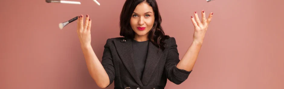 Cosmetologist throwing makeup brushes