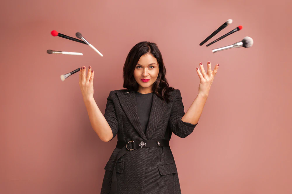 Cosmetologist throwing makeup brushes
